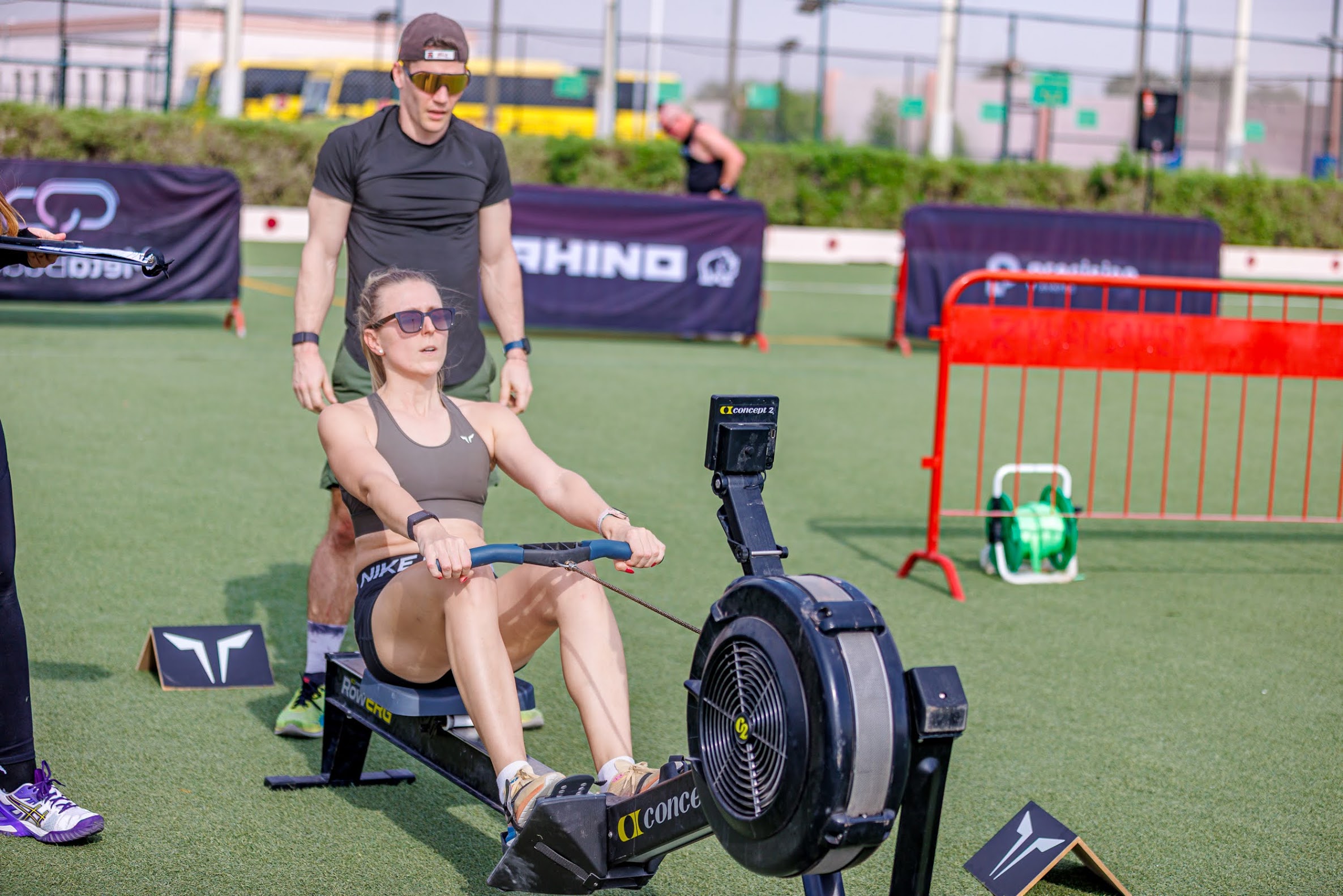 Two athletes rowing together at CrossFit Angkor