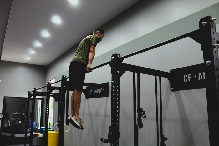 Athlete performing a muscle-up at CrossFit Angkor, Siem Reap